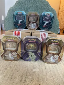 2 Sealed Cases + 6 tins Of Pokemon Triple Whammy Tins - Image 1