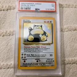 1999 Pokemon Jungle Snorlax-Holo No Symbol PSA 7 NM #11 - Image 1