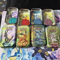 Set of 8 Prismatic Evolutions EMPTY Mini Tins With Pokemon Art Cards And Coins - Image 2