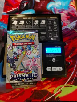 Pokemon Scarlet & Violet Prismatic Evolutions Sealed Booster Weighs 22.45 grams - Image 1