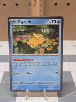 Psyduck Cosmos Holo SWIRL! Mega Evolution Black Star Promo 007 Pokemon TCG - Image 1