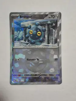 Bronzor (Master Ball Pattern) 066/131 Holo SV: Prismatic Evolutions Pokemon NM - Image 1