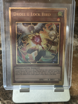 Droll & Lock Bird MAGO-EN006 Maximum Gold 1st Edition Yugi-oh Card - Image 1
