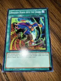YuGiOh! - Dragged Down into the Grave DCR-EN084 Common 25th Anniversary Edition - Image 1