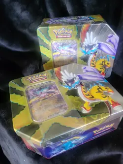 Pokemon Trading Card Game / Paradox Destinies Tin featuring Raging Bolt - Image 1