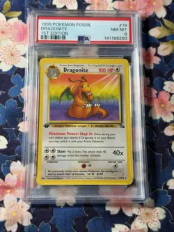 1999 POKEMON FOSSIL 1ST ED #19 DRAGONITE PSA 8 - Image 1