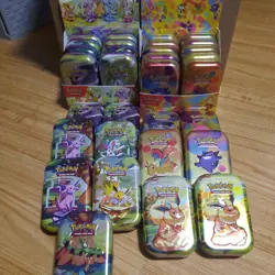 Pokemon 151 & Prismatic Evolutions Mini Tin Display Box & Tins, Coins, No Packs - Image 1