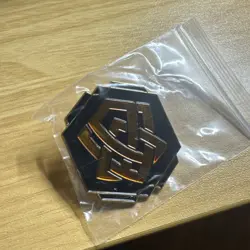 Lorcana Archazia's Island Amber Ink Logo Pin - League Exclusive - Image 1