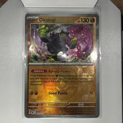 Okidogi (Master Ball Pattern) 057/131 Sv: Prismatic Evolutions Holo pokemon card - Image 1