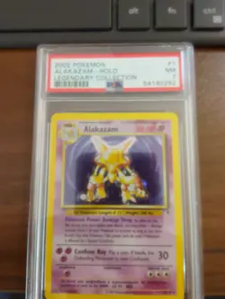 Pokemon TCG 2002 Legendary Collection - Alakazam 1/110 Rare Holo PSA 7 NM - Image 1