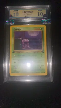 Grimer 48/62 First Edition Graded 10 Near Mint PGC pokemon card 1999 - Image 1