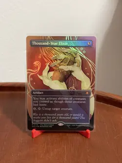 MTG Magic Thousand-Year Elixir FOIL BORDERLESS Lorwyn Eclipsed - Image 1