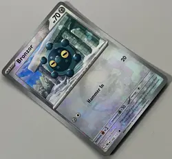 Pokemon Prismatic Evolutions Bronzor Basic #066PBALL Common Reverse Holo 066/131 - Image 3