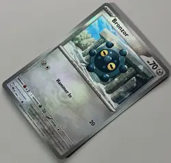 Pokemon Prismatic Evolutions Bronzor Basic #066PBALL Common Reverse Holo 066/131 - Image 4