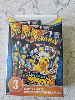 TCG Surging Sparks Booster Bundle Sealed with 3 Pokemon Packs Scarlet & Violet - Image 1