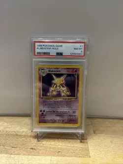 1999 Pokemon Base Set Alakazam Holo 1/102 PSA 8 - Image 1