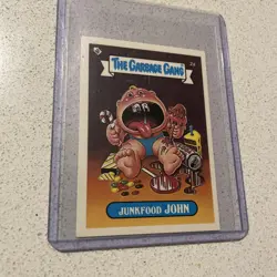 1985 The Topps Company The Garbage Gang Junkfood John 2a Sticker - Image 1