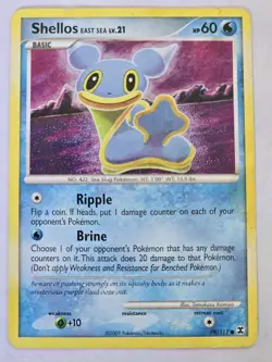Shellos 79/111 - Rising Rivals Pokemon Card - Tomokazu Komiya Art - Image 1