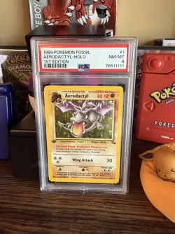 1999 POKEMON FOSSIL 1ST EDITION #1 AERODACTYL-HOLO PSA 8 - Image 1