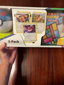 Pokemon Eevee Evolutions 3-Pack Treasure Chest Tin & 2 PokeBalls - Costco - Image 2