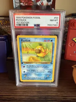 1999 POKEMON FOSSIL #53 PSYDUCK 1ST EDITION PSA 8 NM-MT - Image 1