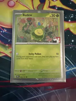 Play! Pokemon Prize Pack Series 7 Prismatic Evolutions Cosmo Holo 004/131 Budew - Image 1