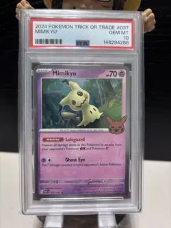Mimikyu 037/091 PSA 10 Gem Mint Trick or Trade 2024 Cosmos Holo Pokemon Card 🔥 - Image 1