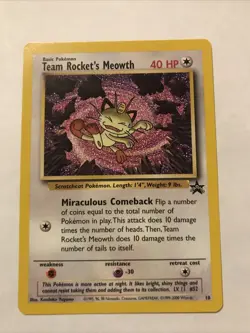 Team Rocket's Meowth Black Star Promo Pokemon Card #18 - Image 1