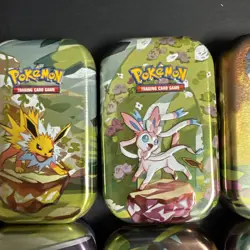 Pokemon Prismatic Evolutions Eeveelutions Mini Tin Full Set 8 Empty Coin Art - Image 4