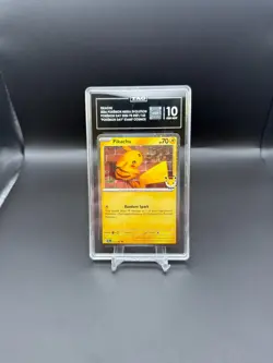 2026 Pokemon - Pikachu (Pokemon Day 2026) Cosmos Holo 051 - TAG 10 + SWIRL!! - Image 1