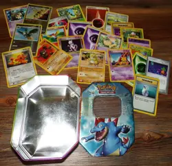 Pokemon Tin with assorted Pokemon Cards - Image 1