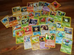 Pokemon Tin with assorted Pokemon Cards - Image 4