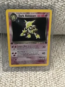 Pokemon Dark Alakazam Team Rocket 1st Edition Holo Rare 1/82, in plastic sleeve - Image 1