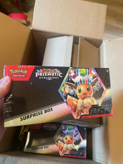 (LOT OF 12) Pokemon TCG Prismatic Evolutions Surprise Box (SEALED IN HAND) - Image 1