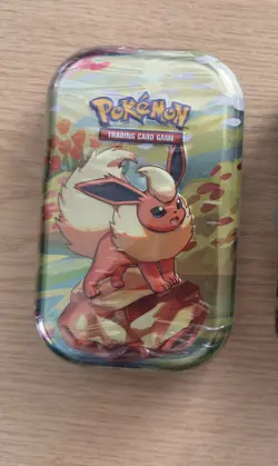 Pokemon Scarlet & Violet Prismatic Evolutions Mini Tin Flareon New SEALED - Image 1