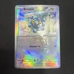 Bronzor Master Ball Reverse Holo Pokemon TCG Prismatic Evolutions Card 066/131 - Image 1
