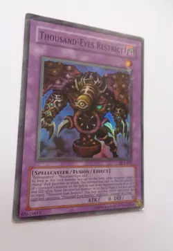 Thousand-Eyes Restrict DL1-001 (Super Rare, Unlimited, Heavily Played / HP) - Image 1