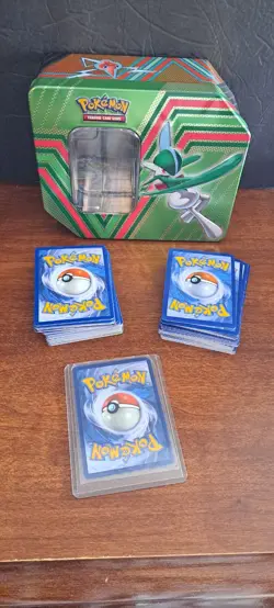 Pokemon Green Tin with Approx 130 trading cards - Image 1