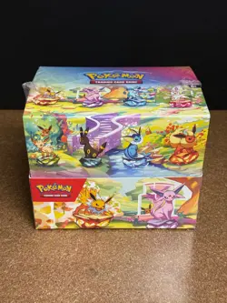 POKEMON PRISMATIC EVOLUTIONS FACTORY SEALED 10 CT MINI TIN DISPLAY SV8.5 - Image 1