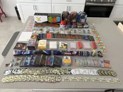 Huge Pokemon Supply Lot Sleeves, Cards, Pins, Tins, Coins, Playing Mats - Image 1
