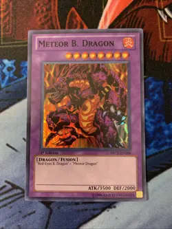 Yugioh! Meteor B. Dragon PRC1-EN004 Super Rare 1st Edition NM/M - Image 1
