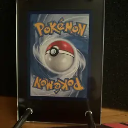 A Pokemon Charizard 25th anniversary card Chinese with a case and stand ￼ - Image 2