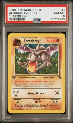 1999 POKEMON FOSSIL #1 AERODACTYL-HOLO 1ST EDITION PSA 8 - Image 1