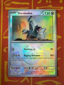 POKEMON TCG DURALUDON 069/131 MASTERBALL HOLO RARE NM PRISMATIC EVOLUTIONS - Image 1