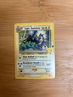 The Pokemon Company Light Toxtricity Celebration Promo Holo SWSH137 - Image 1