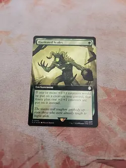 Hardened Scales Extended Art Surge Foil Universes Beyond Fallout MTG NM - Image 1