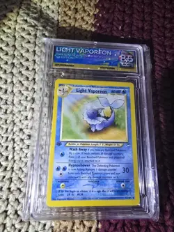 Pokemon TCG Light Vaporeon Neo Destiny 1st Edition Graded PGX 8.5 - Image 1