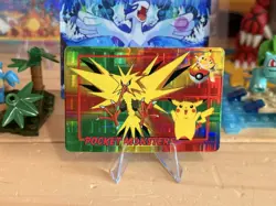 1998 Vintage Pocket Monsters Prism Sticker - Zapdos & Pikachu, Stamp - Grid Holo - Image 1