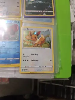 Eevee SWSH095 - Black Star Promo Cosmos Holo Rare Pokemon MEW TAIL SWIRL - Image 1