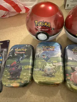 Pokemon TCG Lot W/ Prismatic, 3 Balls, 4 Tins And 1 Double Pack With Pong Coin - Image 2